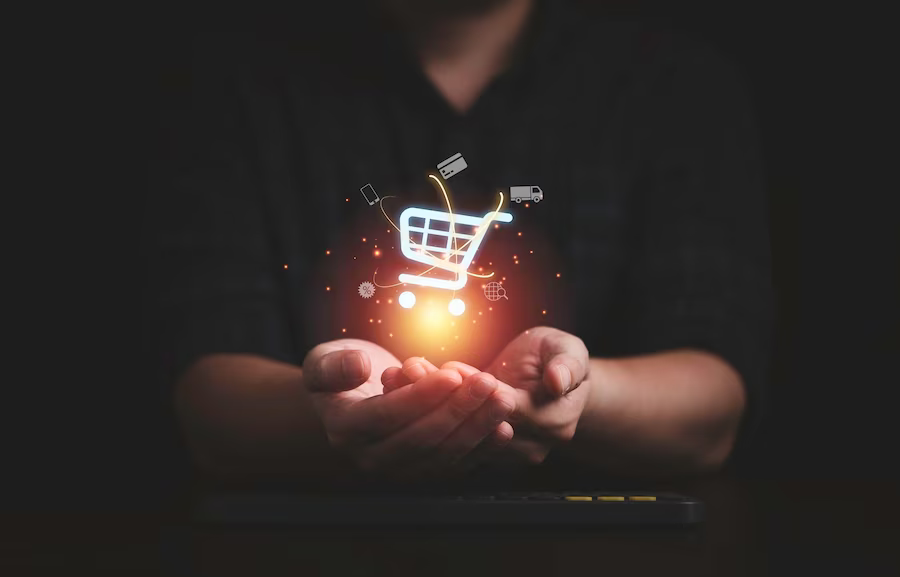 hand-holding-virtual-info-graphics-with-trolley-cart-icons-technology-online-shopping-business-concept_50039-3922